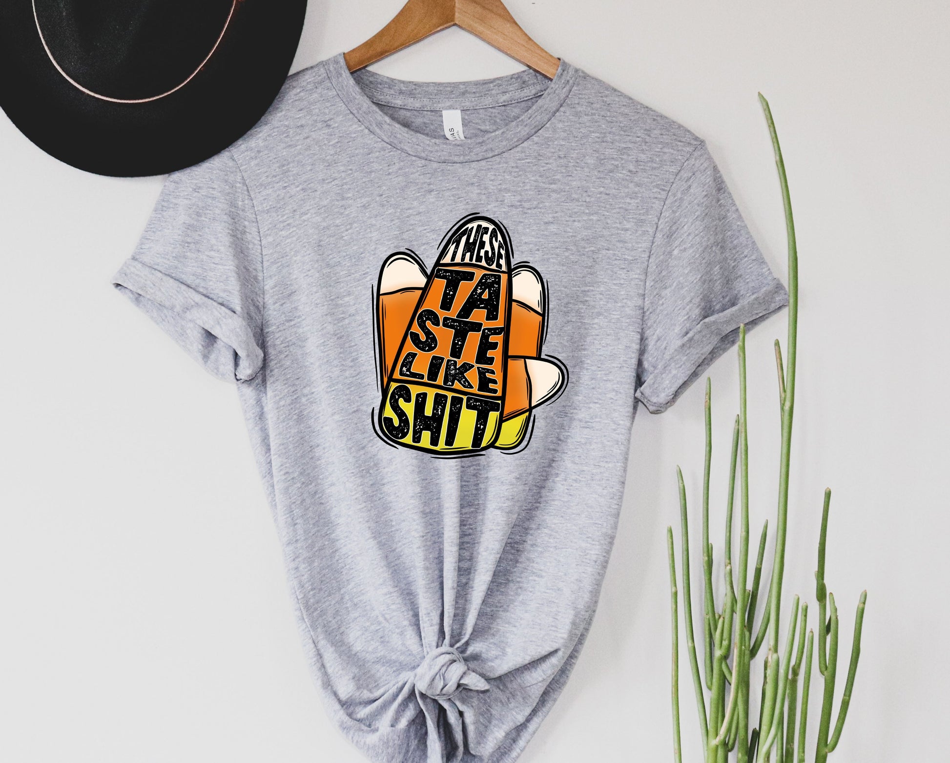 Wholesale Candy Corn Tastes Like Sh*t Graphic Tee - Sand