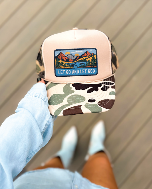Let Go Let God DTF Printed on A Duck Camo and Tan Trucker Hat